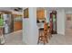 Open kitchen with stainless steel appliances, breakfast bar and counter seating at 23465 Harborview Rd # 842, Port Charlotte, FL 33980