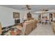 Open-concept living room with tile flooring, comfortable seating, and bright lighting at 23465 Harborview Rd # 842, Port Charlotte, FL 33980