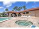 Poolside bliss awaits with a pristine pool, relaxing hot tub, and comfortable lounge chairs under sunny skies at 23465 Harborview Rd # 842, Port Charlotte, FL 33980