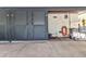 Storage area with gray doors and hose connected to wall at 23465 Harborview Rd # 842, Port Charlotte, FL 33980
