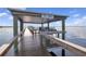 Enjoy waterfront views from this covered tiki bar on a wooden pier, the perfect spot to relax at 23465 Harborview Rd # 842, Port Charlotte, FL 33980