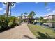 Charming pathway over a bridge with views of the lake and neighboring buildings in a tranquil setting at 23465 Harborview Rd # 842, Port Charlotte, FL 33980