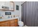 Bathroom featuring a vanity sink, toilet, and shower with modern fixtures at 242 Seminole Nw Blvd, Port Charlotte, FL 33952