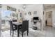 Dining area with tile floors, modern table set, and bright view to the outdoor pool at 242 Seminole Nw Blvd, Port Charlotte, FL 33952