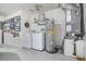 Functional laundry room area with washer, dryer, water heater, HVAC system, and storage at 242 Seminole Nw Blvd, Port Charlotte, FL 33952