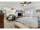 Well-lit main bedroom with large closet, ceiling fan, and access to a door to the outside at 242 Seminole Nw Blvd, Port Charlotte, FL 33952