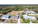 Aerial view of property with screened-in pool, lush greenery, and adjacent waterways at 3249 Cedarbrook Dr, Punta Gorda, FL 33982