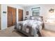 Cozy bedroom with carpet, two closets, and large window at 3249 Cedarbrook Dr, Punta Gorda, FL 33982
