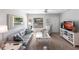 Cozy living room featuring comfortable seating, neutral decor, and ample natural light at 3249 Cedarbrook Dr, Punta Gorda, FL 33982