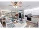 Open-concept living space featuring a dining table, modern kitchen, and cozy living room at 3249 Cedarbrook Dr, Punta Gorda, FL 33982