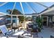 The home features a screened patio area with comfortable seating and outdoor lounging at 3249 Cedarbrook Dr, Punta Gorda, FL 33982