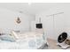 Neutral bedroom with patterned bedspread, decorative art, and plenty of space for comfortable living at 3476 Brewster Rd, North Port, FL 34288