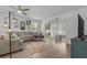 Cozy living room with plush sofa, stylish decor, and sliding glass doors at 3476 Brewster Rd, North Port, FL 34288