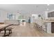 Spacious open-concept living area with modern decor and natural light at 3476 Brewster Rd, North Port, FL 34288
