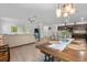 Open-concept living space connects kitchen, dining, and living areas at 3476 Brewster Rd, North Port, FL 34288