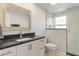 Bathroom featuring granite counters, white cabinets, and glass shower at 3480 Pinetree St, Port Charlotte, FL 33952