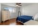 Bedroom with wood floors, light dresser, and window at 3480 Pinetree St, Port Charlotte, FL 33952