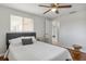 Bright bedroom with wood floors, ceiling fan, and modern decor at 3480 Pinetree St, Port Charlotte, FL 33952