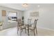 Dining room features a glass table and modern decor at 3480 Pinetree St, Port Charlotte, FL 33952