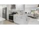 Modern kitchen featuring stainless steel appliances and ample countertop space at 3480 Pinetree St, Port Charlotte, FL 33952