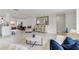 Open living space with neutral decor, a large mirror, and ample seating at 3480 Pinetree St, Port Charlotte, FL 33952