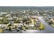 Panoramic aerial view of waterfront homes along interconnected canals surrounded by mature trees at 4178 Rose Arbor Cir, Port Charlotte, FL 33948