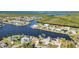 Breathtaking aerial view of a waterfront community, featuring beautiful deep water canal access at 4178 Rose Arbor Cir, Port Charlotte, FL 33948