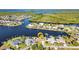 An aerial view highlighting waterfront living with boating access, close to local amenities at 4178 Rose Arbor Cir, Port Charlotte, FL 33948
