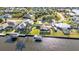Scenic aerial shot showcasing deep water canal access and beautiful home with private boat dock at 4178 Rose Arbor Cir, Port Charlotte, FL 33948