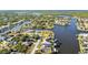 This aerial shot highlights waterfront community, perfect for boating and enjoying coastal living at 4178 Rose Arbor Cir, Port Charlotte, FL 33948