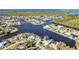 Aerial view of canal front homes, showcasing waterfront living and community layout with vast waterway access to the ocean at 4178 Rose Arbor Cir, Port Charlotte, FL 33948