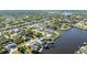 Breathtaking aerial showcasing waterfront homes along winding canals surrounded by greenery at 4178 Rose Arbor Cir, Port Charlotte, FL 33948