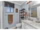 Bathroom featuring an elegant vanity, mirror, and natural light from a window at 4178 Rose Arbor Cir, Port Charlotte, FL 33948