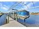Covered boat lift for boating convenience on your waterfront property at 4178 Rose Arbor Cir, Port Charlotte, FL 33948