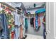 Walk-in closet with multiple shelves, rods, and ample storage space at 4178 Rose Arbor Cir, Port Charlotte, FL 33948