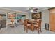 Cozy dining area adjacent to a seating area, featuring a round wooden table with four chairs at 4178 Rose Arbor Cir, Port Charlotte, FL 33948