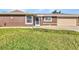 Charming one-story home with well-maintained landscaping and walkway leading to the front door at 4178 Rose Arbor Cir, Port Charlotte, FL 33948