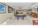 Open-concept living area with a game room, dining table, and comfortable seating area at 4178 Rose Arbor Cir, Port Charlotte, FL 33948