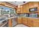 Charming kitchen with marble countertops, stainless steel appliances, and recessed lighting at 4178 Rose Arbor Cir, Port Charlotte, FL 33948