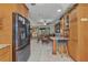 Kitchen with bar seating that looks into a dining room with a view at 4178 Rose Arbor Cir, Port Charlotte, FL 33948