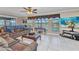 Inviting living room with water views, cozy sofas, and a media center at 4178 Rose Arbor Cir, Port Charlotte, FL 33948