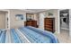 Bedroom featuring elegant wood dressers, closet, and cool-toned bedding at 4178 Rose Arbor Cir, Port Charlotte, FL 33948