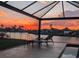 Enjoy the canal view from the screened patio while watching the sunset at 4178 Rose Arbor Cir, Port Charlotte, FL 33948