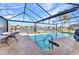 Enjoy the outdoors with a sparkling screened pool, covered lanai, and calming waterfront views at 4178 Rose Arbor Cir, Port Charlotte, FL 33948