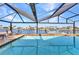 Relax by the pool inside the screened lanai with great views of deep water canal at 4178 Rose Arbor Cir, Port Charlotte, FL 33948