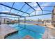 Relaxing outdoor space with pool, screened enclosure, and views of the serene canal beyond at 4178 Rose Arbor Cir, Port Charlotte, FL 33948