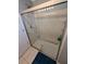 Modern shower with sliding glass door, tiled walls, and tiled floor at 4178 Rose Arbor Cir, Port Charlotte, FL 33948