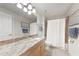 Bright bathroom featuring a large vanity, granite countertop, and tiled shower/tub combo at 5114 Melbourne St # A202, Punta Gorda, FL 33980