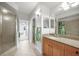 Bathroom featuring tile floors, granite countertops, a single sink, and a glass shower at 5114 Melbourne St # A202, Punta Gorda, FL 33980