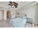 Bedroom featuring carpet, closet, and archway at 5114 Melbourne St # A202, Punta Gorda, FL 33980